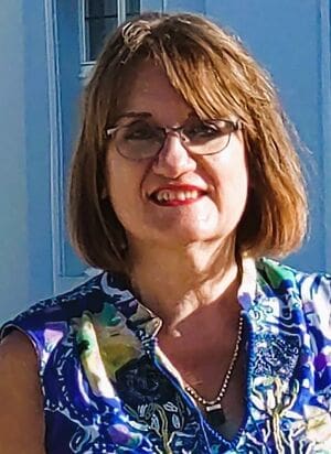 Colour portrait of Anne C. Schneider, German astrologer specialising in relocation astrology and Solar Return techniques.