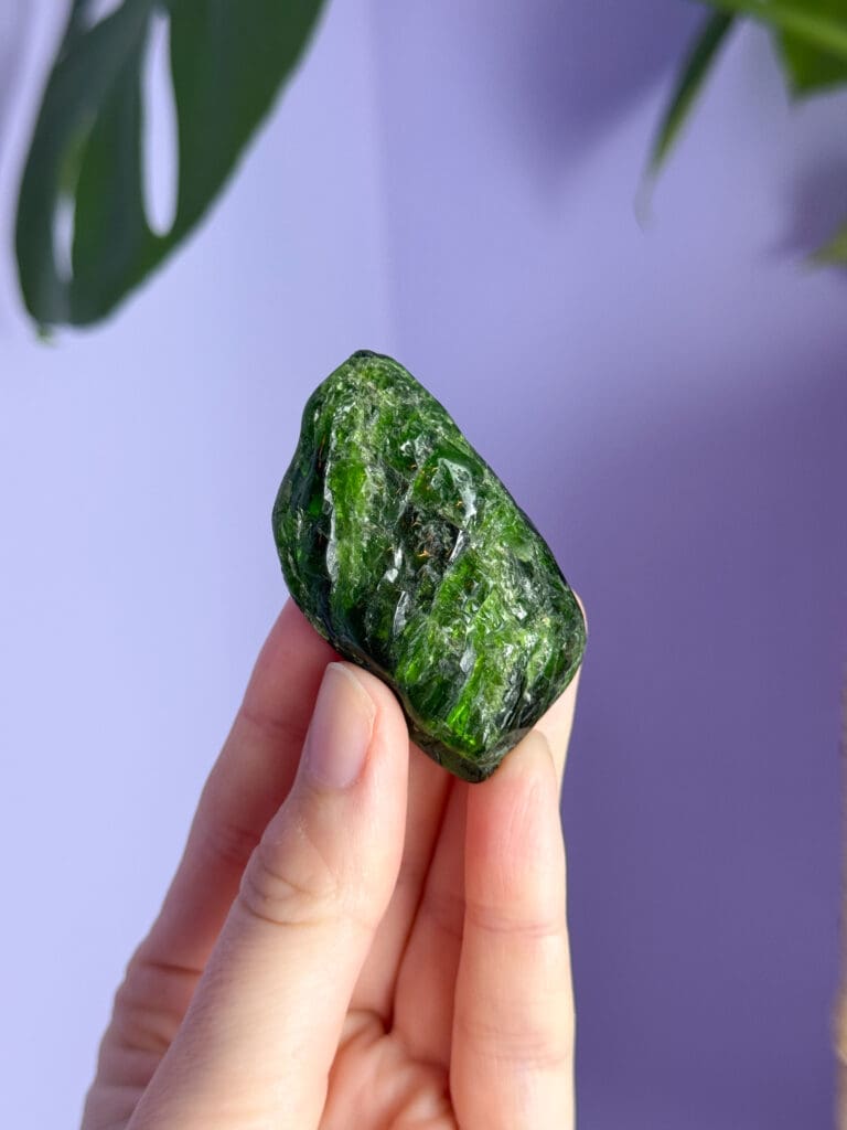 Green stone used in remote activation practice in astrocartography, symbolising connection to place through planetary geography in the Nynne Noel interview article.