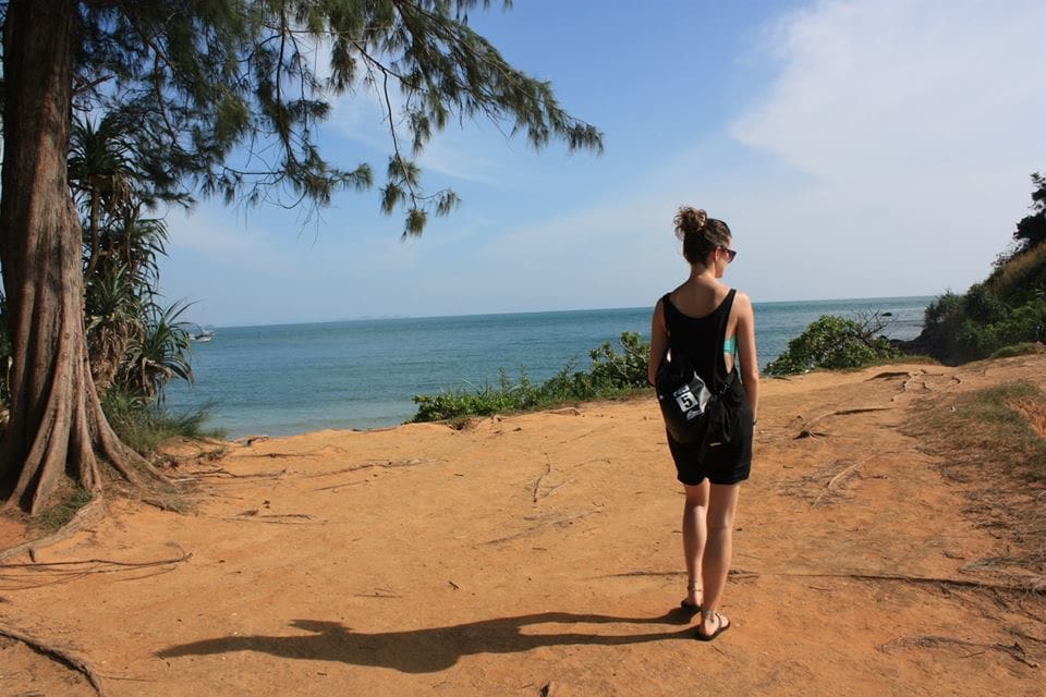 Nynne Noel, Danish certified astrocartographer walking along a coastal path in Thailand during early backpacking years that later inspired experiential astrocartography work.