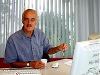 Martin Davis on the consultations page of his AstrologyMapping.com website, pictured working at his desk during his period as a practising certified Astrocartographer