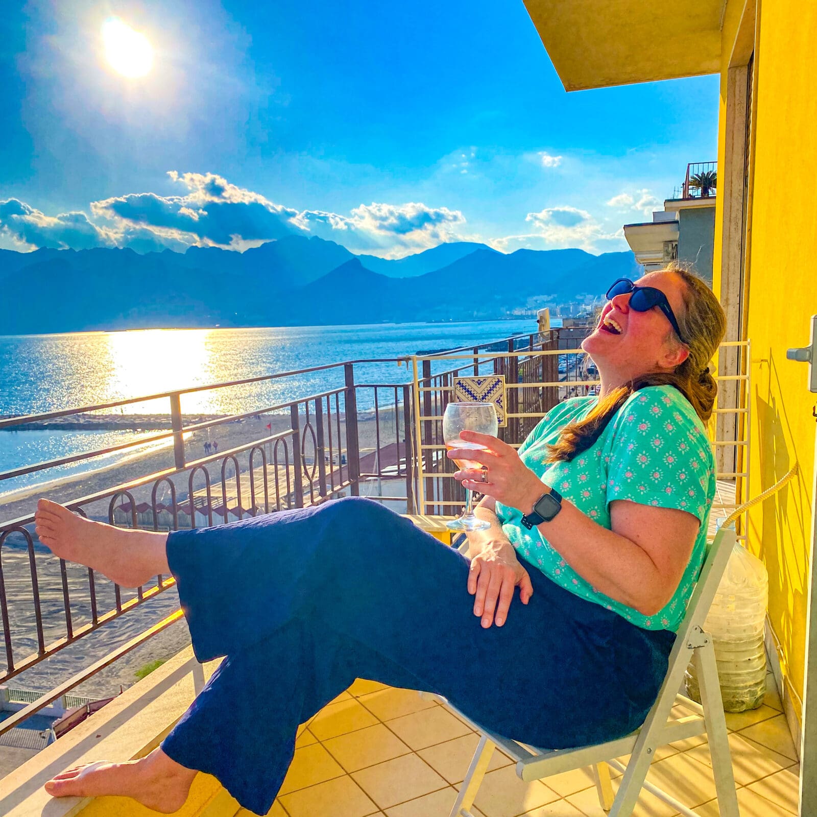 Meg Knox-Davies in Southern Europe experiencing a coastal landscape, illustrating lived hemispheric contrast in astrocartography within the European Astrocartography® Interview Series